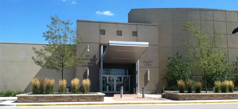 Modern conference center with landscaped entrance.
