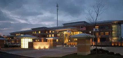 Modern building at dusk with lights