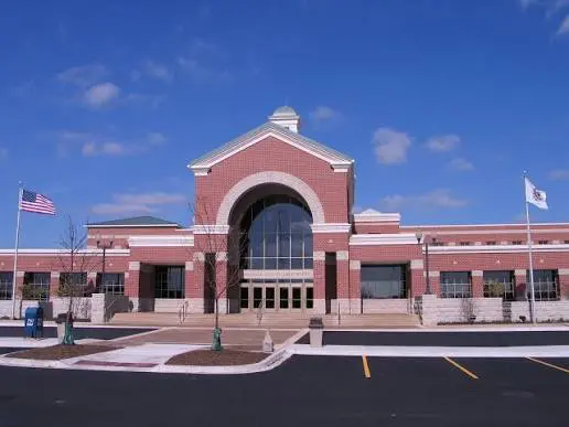 Brick building with large arched entrance.