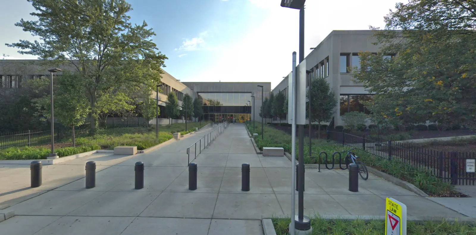 Pathway leading to a modern building entrance.